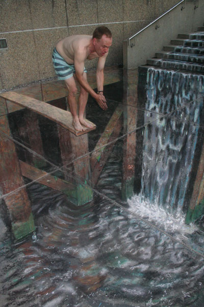 The artist Julian Beever about to dive in his 3D drawing of a water scene